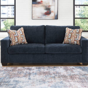 Blue modern queen sofa sleeper with accent pillows in contemporary living room