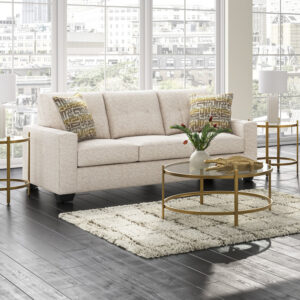 Modern cream queen sleeper sofa with accent pillows in bright contemporary living room
