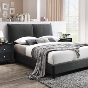 Charcoal gray upholstered platform bed frame with padded headboard in modern bedroom setting