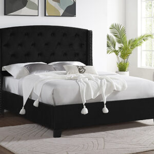 Black tufted upholstered bed frame with tall button-tufted headboard and nailhead trim in modern bedroom