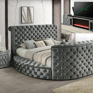 Gray tufted upholstered bed frame with built-in fireplace and hidden TV lift system
