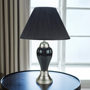 Black porcelain table lamp with black shade on round table