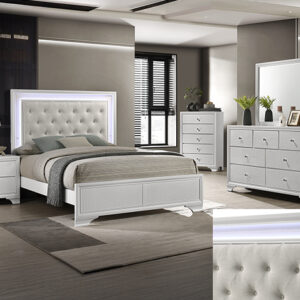 Lyssa oat frost 7-piece bedroom set with tufted upholstered bed, dresser, mirror, chest, and nightstand in a two-tone oat and frost finish with glam accents.