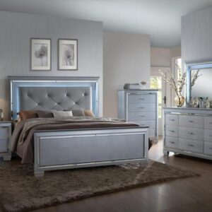 Lillian 7-piece bedroom set with tufted upholstered bed, dresser, mirror, chest, and nightstand in a silver finish with LED headboard lighting and modern glam styling.