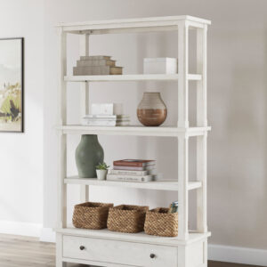 White farmhouse bookcase with open shelves and bottom storage drawer